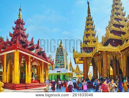 Yangon, Myanmar - February 27, 2018: Crowded Alley Of Shwedagon With Sacred Hair Relic Washing Well 