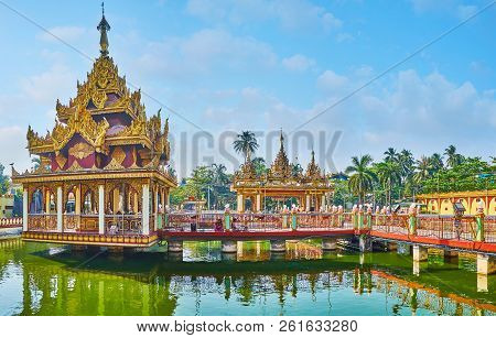 Yangon, Myanmar - February 27, 2018:  Panorama Of Kyay Thone Pagoda, Standing On The Pond And Decora