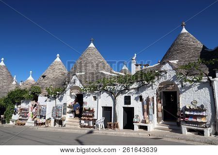 Alberobello, Italy - May 29, 2017: People Visit Alberobello, Italy. Alberobello And Its Trulli House