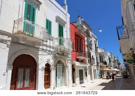 Polignano A Mare, Italy - May 29, 2017: People Visit Polignano A Mare Old Town In Apulia, Italy. Wit
