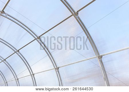 Greenhouse Made Of Polycarbonate And Metal Carcass. Small Hothouse For Private Use. Metal Constructi