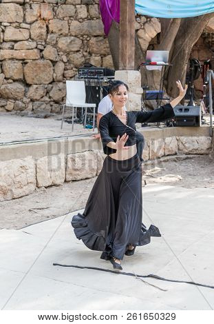 Jerusalem, Israel, September 29, 2018 : Dancer In A Black Authentic Dress Dances To The Music For Vi