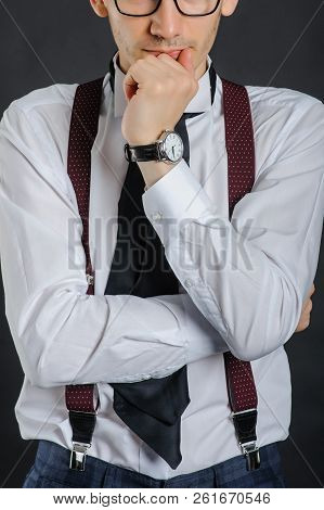 Young Handsome Boy In White Shirt With Tie And Glases, Clock On Hand