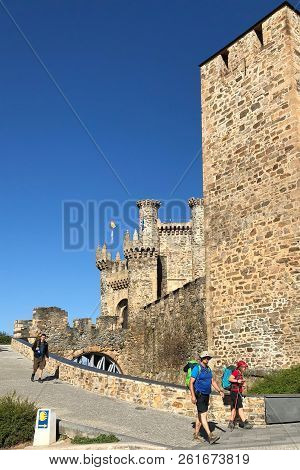 Ponferrada, Spain - September 2018: Pilgrims Of Camino De Santiago Stopped By Templar Castle In Ponf
