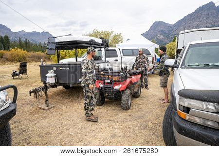 September 16 2018 - Dubois, Wyoming: Adult Male Hunters Gather Around Base Camp, Discussing Plans Fo