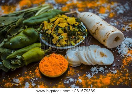 Close Up Of Popular Indian & Asian White Radish Salad Or Muli Ka Smabara On Wooden Surface With Whit