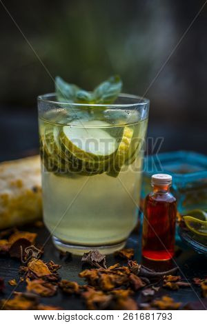Close Up Of Organic Face Pack Of Cucumber With Aloe Vera Gel And Rose Oil On Wooden Surface In A Gla