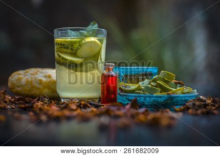 Close Up Of Organic Face Pack Of Cucumber With Aloe Vera Gel And Rose Oil On Wooden Surface In A Gla