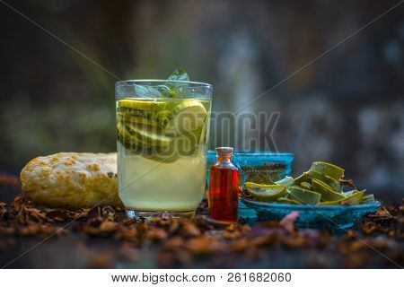 Close Up Of Organic Face Pack Of Cucumber With Aloe Vera Gel And Rose Oil On Wooden Surface In A Gla