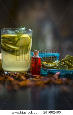 Close Up Of Organic Face Pack Of Cucumber With Aloe Vera Gel And Rose Oil On Wooden Surface In A Gla