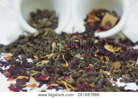 Bright Colorful Fruit And Green Tea Petals Isolated On White Background.