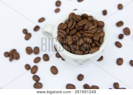 Top View Cup With Coffee Beans And Seeds Isolated On White Background