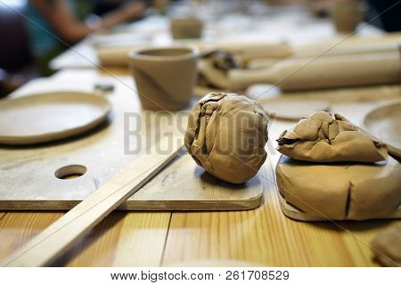 Clods Of Soft Raw Clay On A Wooden Table