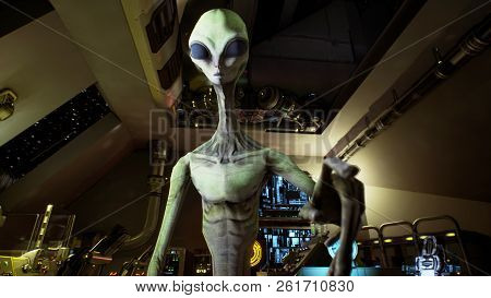 Alien Presses The Keys On Sci-fi Hologaphic Screen. 3d Rendering