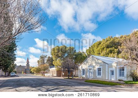 Loxton, South Africa, August 7, 2018: A Street Scene, With Historic Houses And The Dutch Reformed Ch