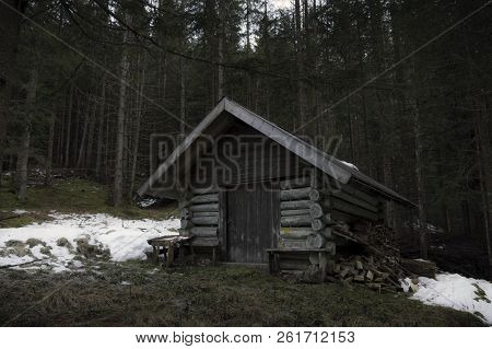Abandoned Wooden Cottage In The Middle Of The Austrian Forest, Near The Village Ehrwald, On A Cold D