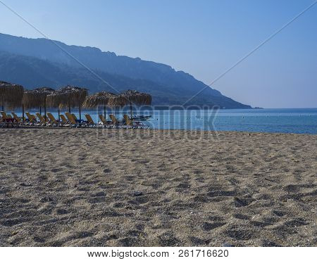 Sand And Pebbles Beach And Turquoise Sea Shore At Agios Georgios Pagon At Corfu Island, Greece With 