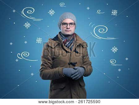 Young hipster frozen boy with doodled snowflakes and windy concept