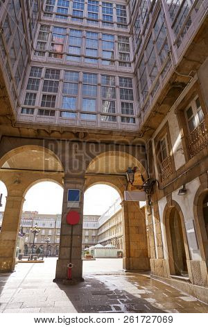 LA CORUNA, GALICIA, SPAIN - JUNE 5: Maria Pita Square arcade and statue on June 5, 2017 in La Coruna, Galicia, Spain
