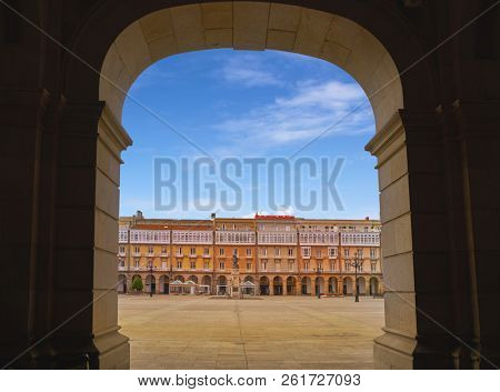 LA CORUNA, GALICIA, SPAIN - JUNE 5: Maria Pita Square arcade and statue on June 5, 2017 in La Coruna, Galicia, Spain