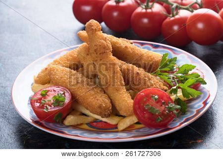 Deep fried chicken frites with potato chips or french fries