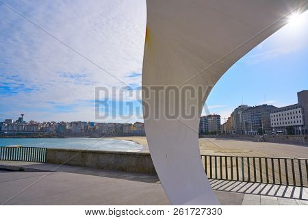 LA CORUNA, GALICIA, SPAIN - JUNE 5: Riazor beach white scuplture memorial to the Orzan Heroes at breakwater on June 5, 2017 in La Coruna, Galicia, Spain
