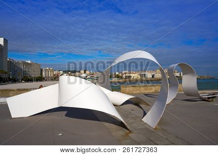 LA CORUNA, GALICIA, SPAIN - JUNE 5: Riazor beach white scuplture memorial to the Orzan Heroes at breakwater on June 5, 2017 in La Coruna, Galicia, Spain