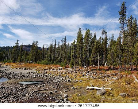 Foliage In Vibrant Fall Colors Of Red And Yellow Along The Shores Of Elk Lake In The Cacade Mountain