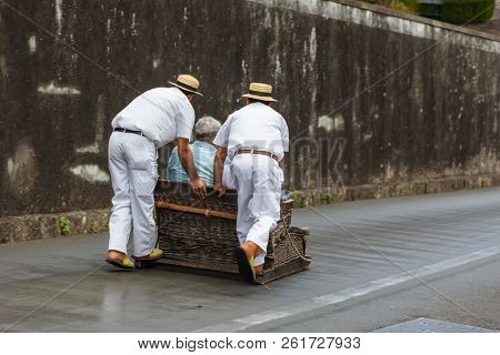 Toboggan riders on sledge in Monte - Funchal Madeira island - Portugal