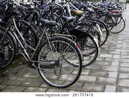 Amsterdam,netherlands - September 06, 2018: Sunset In Amsterdam.bicycle Parking And Traditional Old