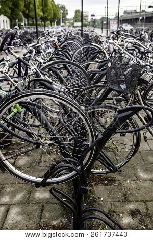 Amsterdam,netherlands - September 06, 2018: Sunset In Amsterdam.bicycle Parking And Traditional Old 