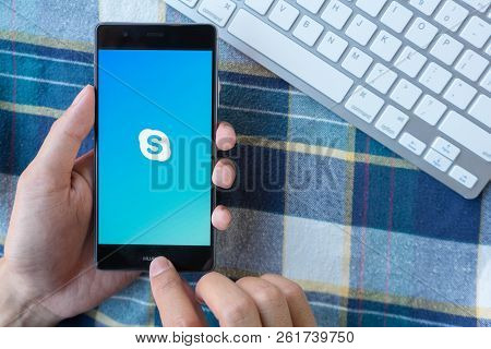 Chiang Mai, Thailand - Mar 28,2018: Man Holding Huawei With Skype Apps On Screen. Skype Is Part Of M