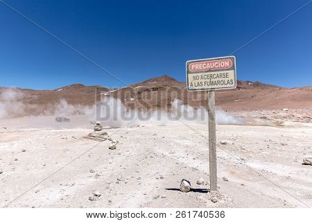 A Sign Asking For Precaution Around The Wild Geyser Of Bolivia, Saying 