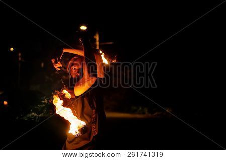 Fire Show. The Fakir Juggles Poi. Night Performance. Dramatic Portrait. Heat And Danger.