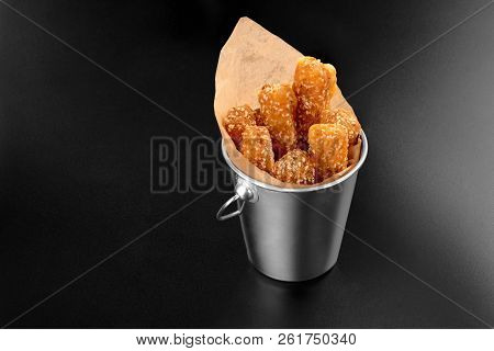 Bbq Cheese Fried Stripes In A Metal Bucket Onblack Background With Sauce Fryed