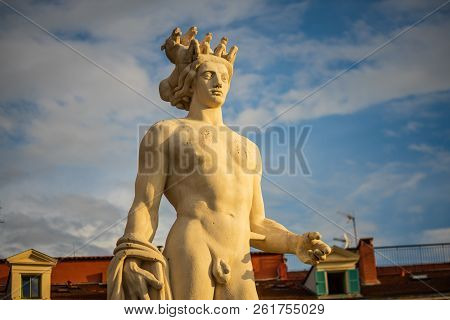 Detail Of The Fountain Soleil Statue At Sunset.
