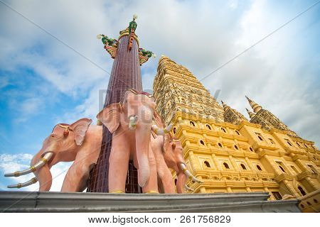 public golden giant huge pagoda big temple buddha statue in Krabi province , southern of Thailand wi