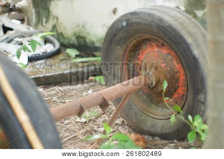 Closed Up. Old Wheel  On  Floor , Earth Tone Blurred Background