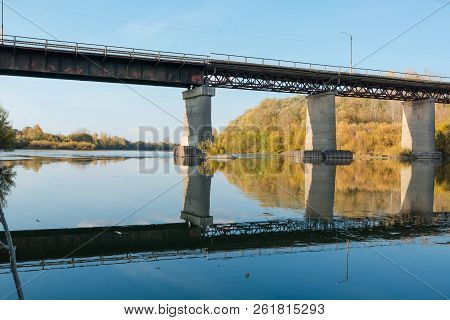 Old Bridge Over The River. Autumn Landscape With A Bridge