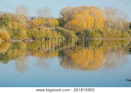 Autumn Landscape Lake. Lake At Sunset. Yellow Foliage