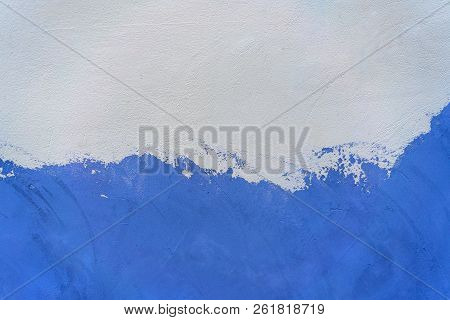 Old White And Blue Painted Concrete Wall.