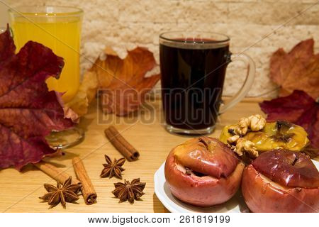 Hot Mulled Wine And Baked Apples With Spices, Walnuts, Cinnamon Sticka, Cloves And Anise Stars, Autu