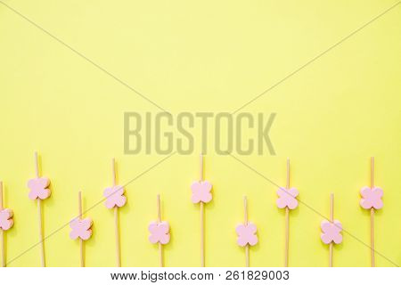 Ecological Skewer Isolated On Yellow Background.wooden Sticks With Flower Beads For Food Decoration.