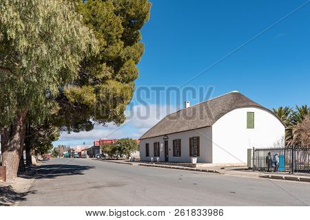 Fraserburg, South Africa, August 7, 2018: A Street Scene, With The Old Pasonage Museum And Businesse