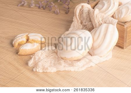 Coockies With Egg White Cover. Portuguese Sweets Known As Cavacas On Napkin In A Table.