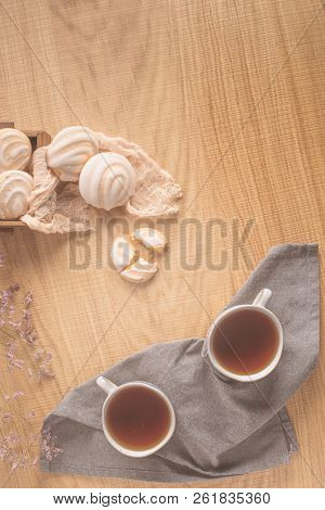 Coockies With Egg White Cover. Portuguese Sweets Known As Cavacas Served With Tea On Ceramic Cups.