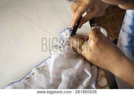 Thai Woman People Fold Bundle And Sewing Or Arashi Shibori On Fabric At Workshop In Nonthaburi, Thai
