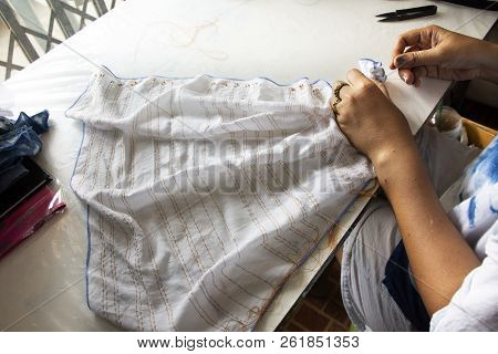 Thai Woman People Fold Bundle And Sewing Or Arashi Shibori On Fabric At Workshop In Nonthaburi, Thai