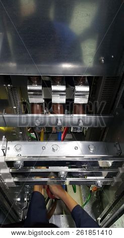 Electrical Parts And Mechanical Parts On Big Gear And Drum Rolls On White Floor