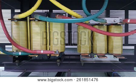Electrical Parts And Mechanical Parts On Big Gear And Drum Rolls On White Floor